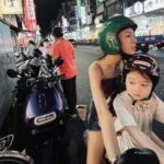 Left Handed Girl 2025 Woman And Child On Moped In Taiwan