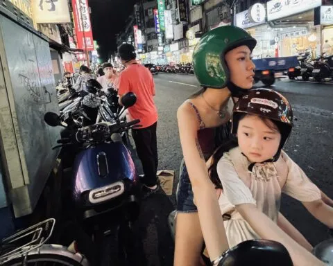Left Handed Girl 2025 Woman And Child On Moped In Taiwan